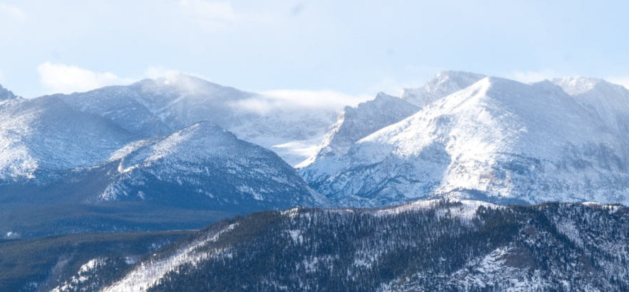 Snow-capped mountain range with blue sky